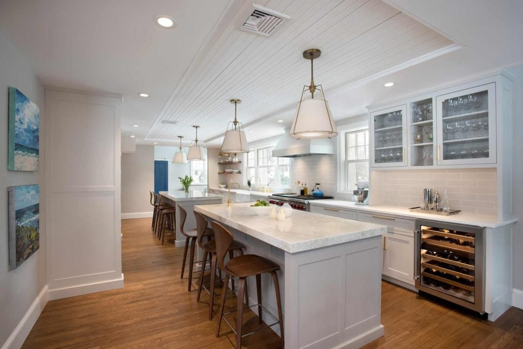 A completed Sleeping Dog Properties, Inc. green remodeling job inside an all-white kitchen