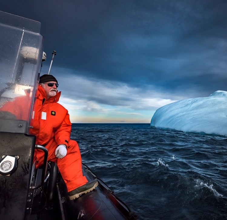 Barry Rogers, of Iceberg Quest Ocean Tours operating in St. John's and Twillingate, rides his boat past an iceberg