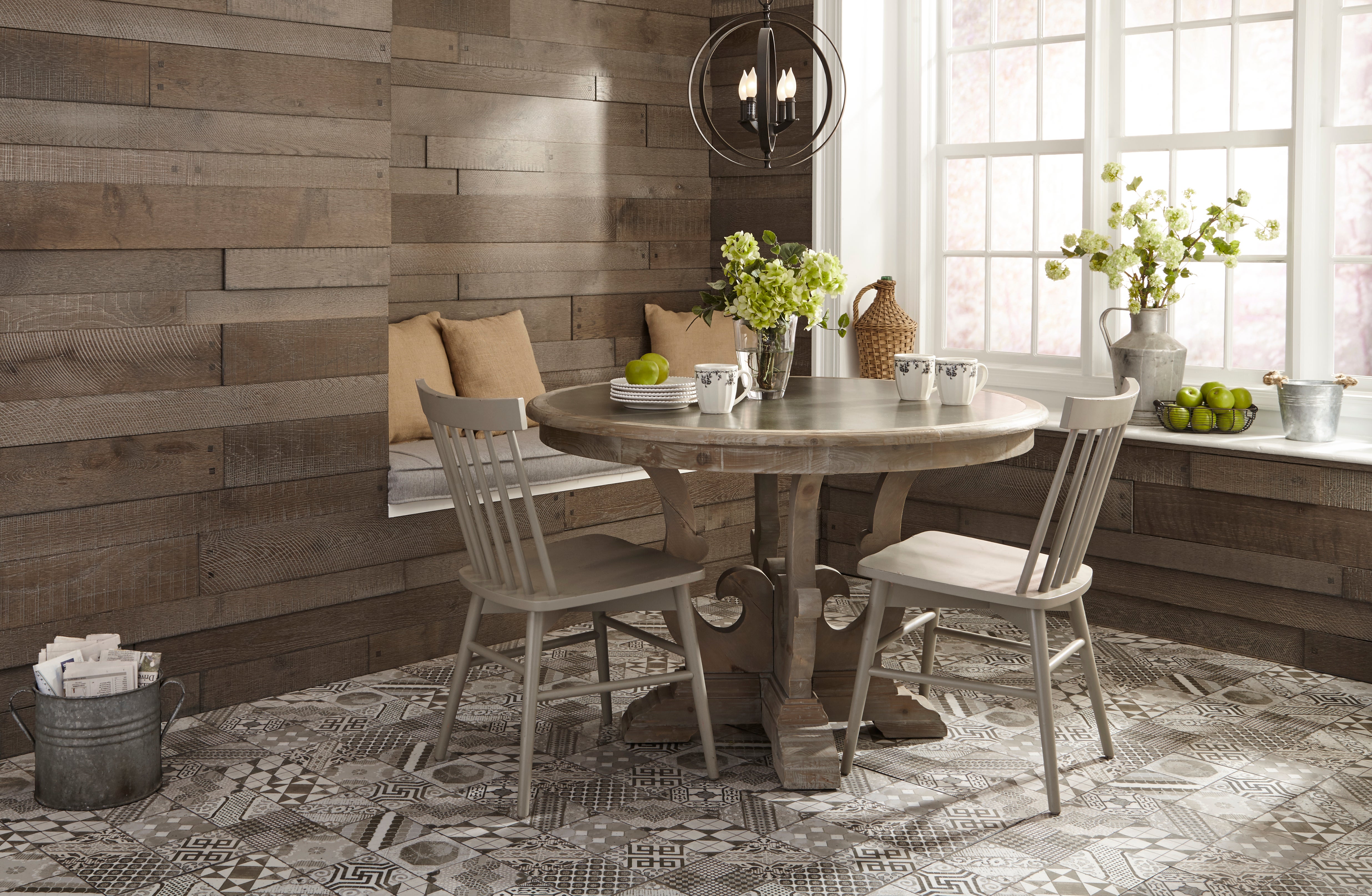 Farmhouse style breakfast nook with porcelain tile floors and oak wall paneling.