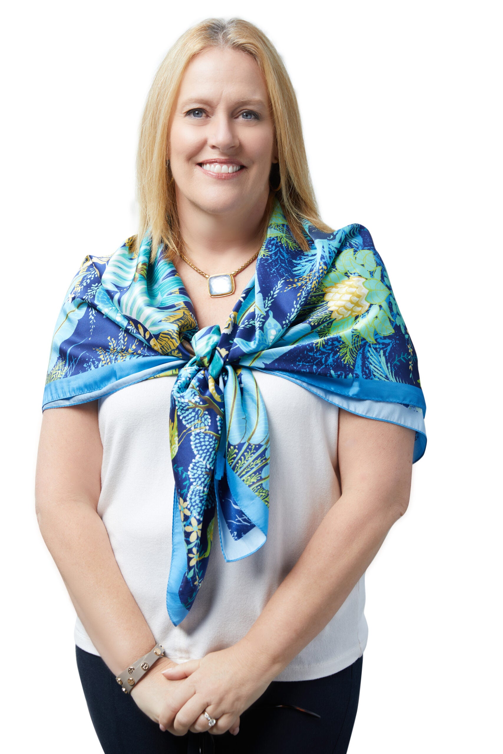 Pauline Bennett wearing blue shawl and standing in front of white background