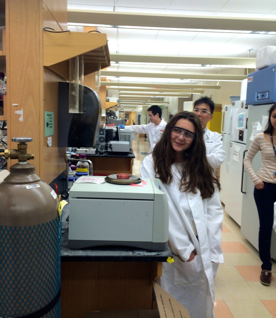 Camper wearing a lab coat waiting on the results of the experiment 