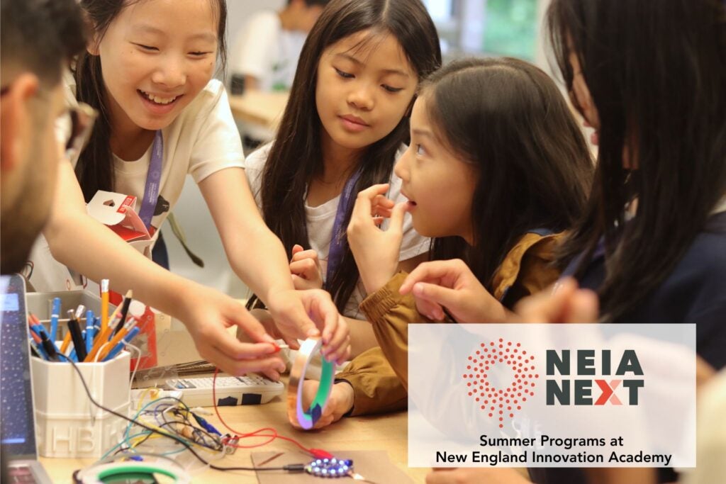 Group of teenagers communally working on a project 