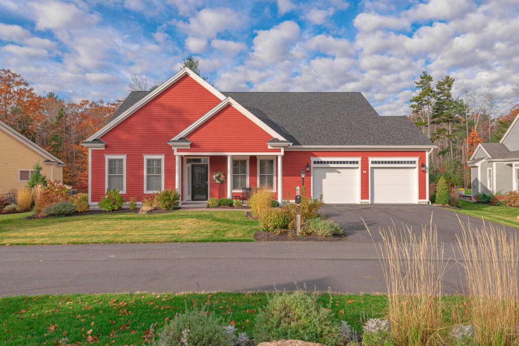 Red house surrounded by grass 