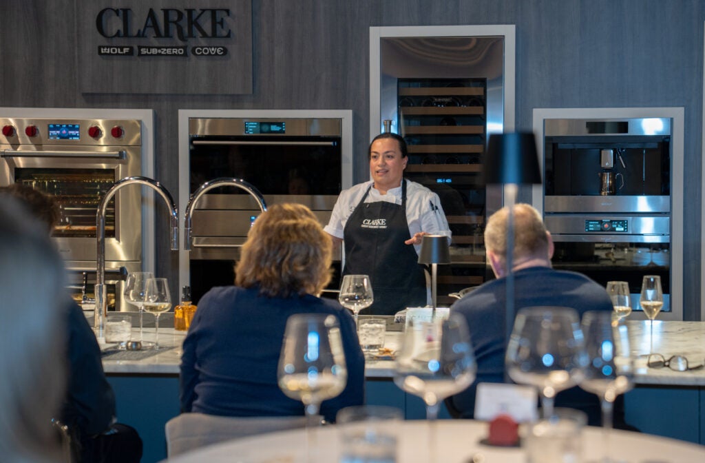 Chef in a Clarke showroom speaking with clients