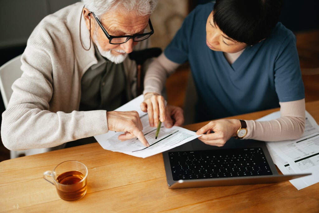 Patient and doctor reviewing a medical form 