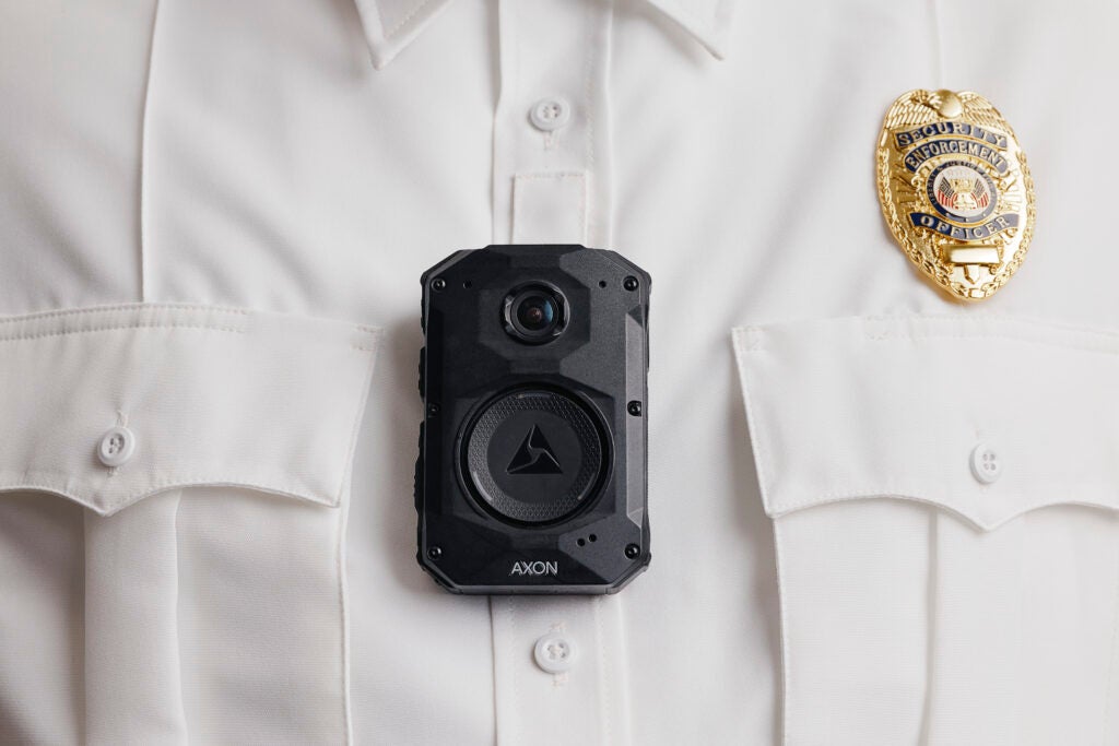 Police officer wearing a shirt with an attached body camera
