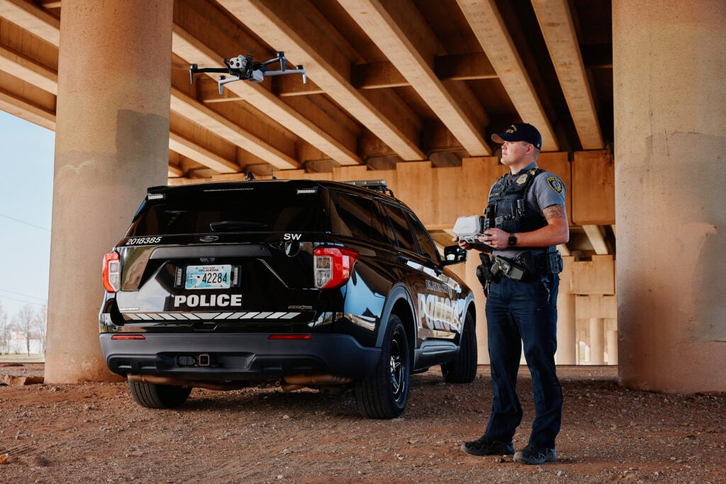 Police officer piloting a drone